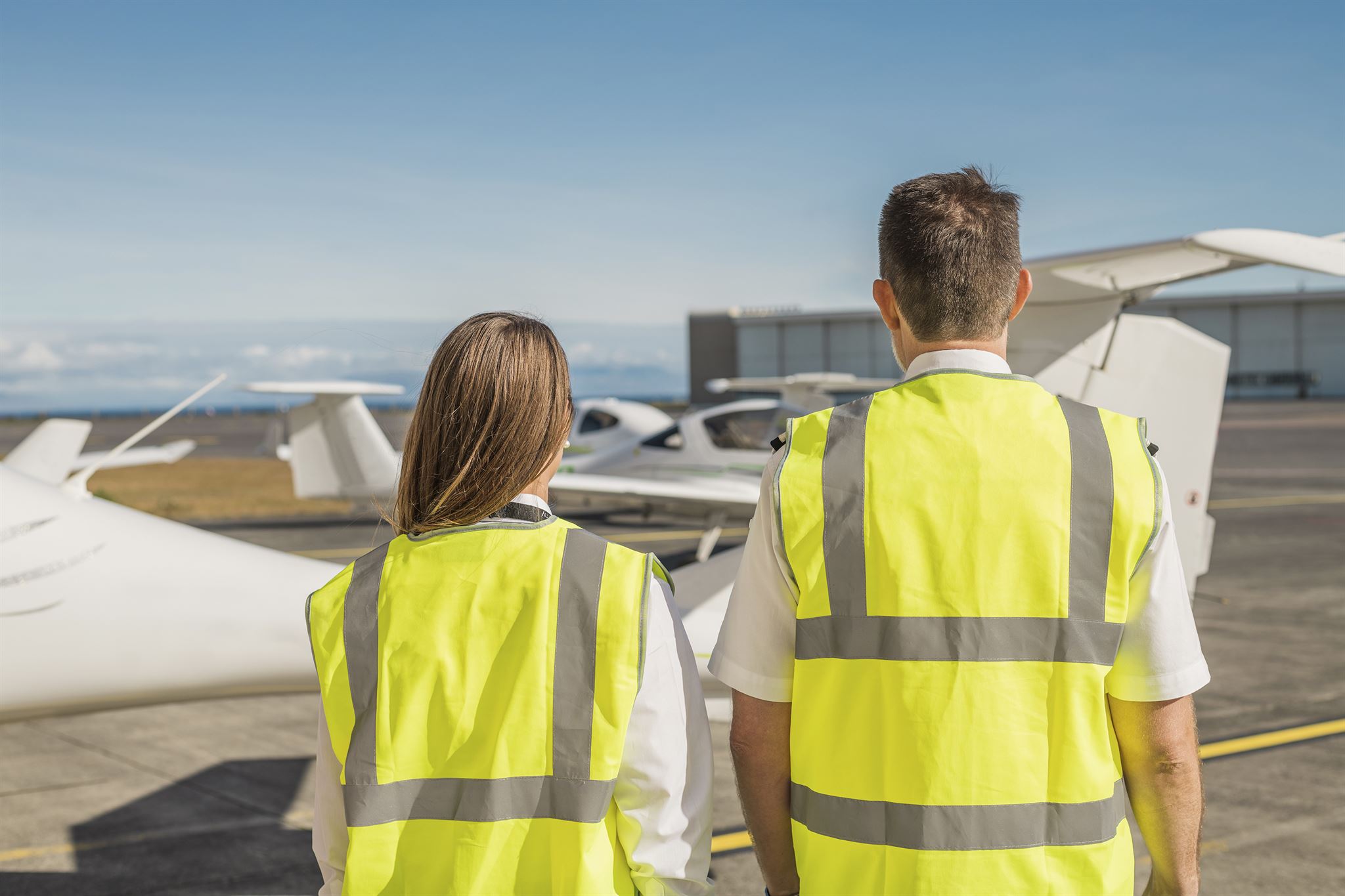 Flight attendants serving passengers